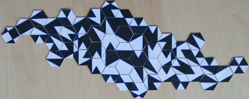 A white and a black closed shape using all tiles.